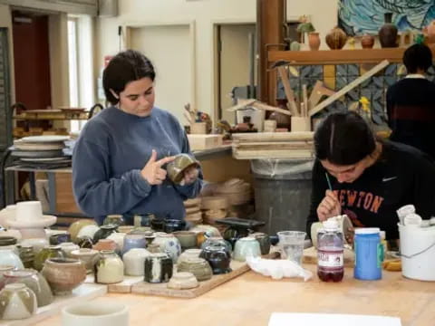 a man and a woman painting