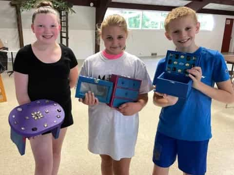 a group of children holding toys