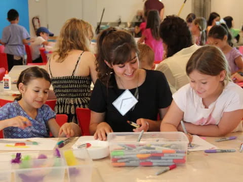 a group of children sitting at a table