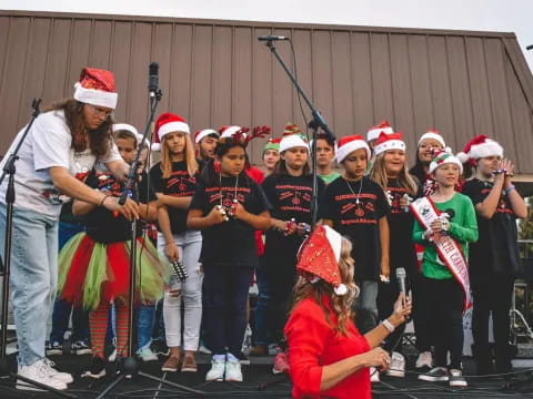 a group of people wearing santa hats