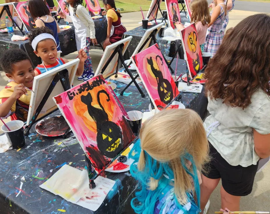 a group of people painting