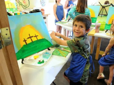 a boy sitting at a table