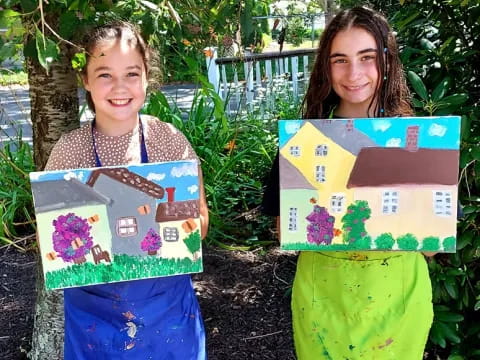 a couple of girls holding boxes