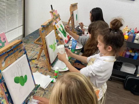 a group of children painting