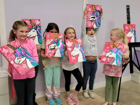 a group of children holding signs