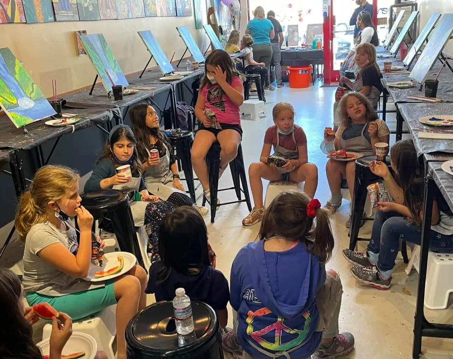 a group of people sitting in a classroom