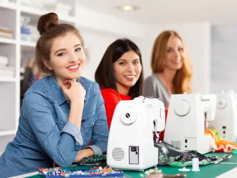 a group of women looking at a computer