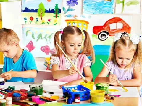 children painting on a table