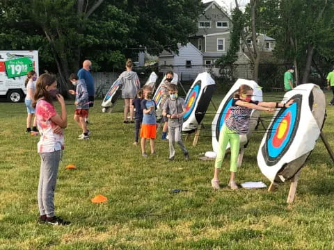 a group of people holding surfboards