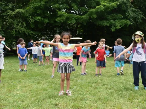 a group of children playing in a field