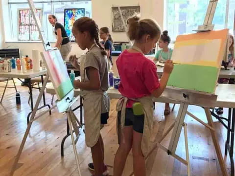 a group of children painting