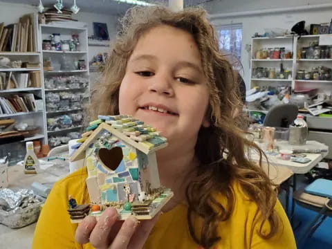 a girl holding a box