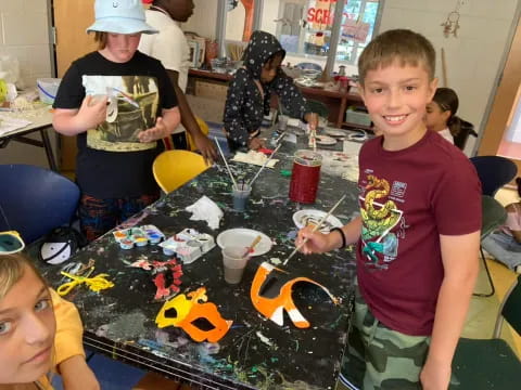 a group of children painting