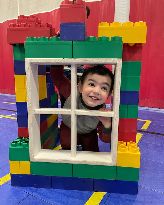 a child in a toy house