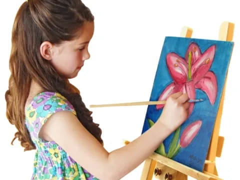 a girl painting a picture