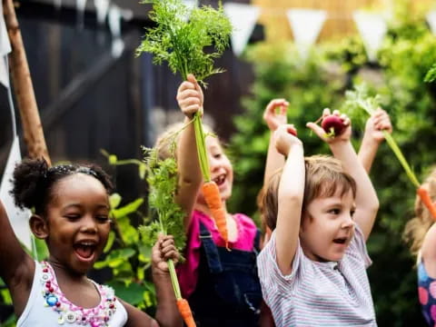 a group of children holding fruits