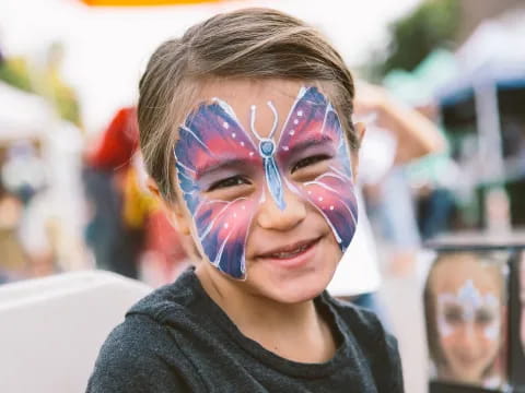 a boy with paint on his face