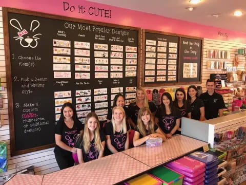 a group of people posing for a photo in front of a menu