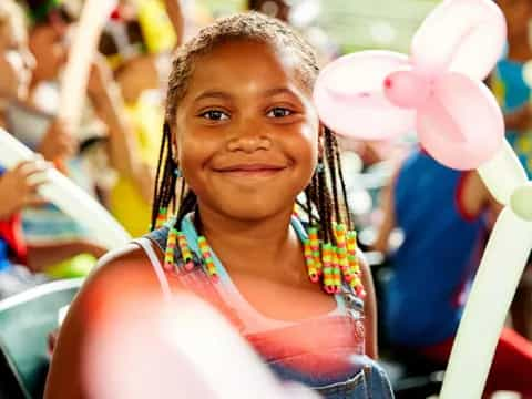 a girl with balloons