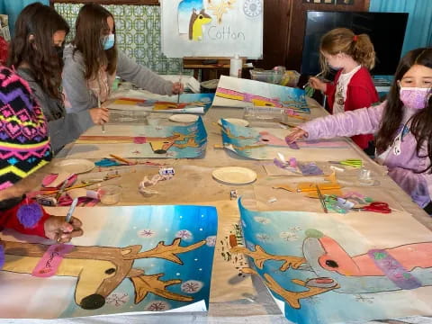 a group of children painting