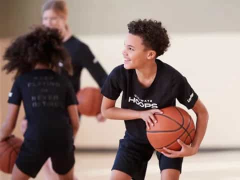 a boy holding a basketball