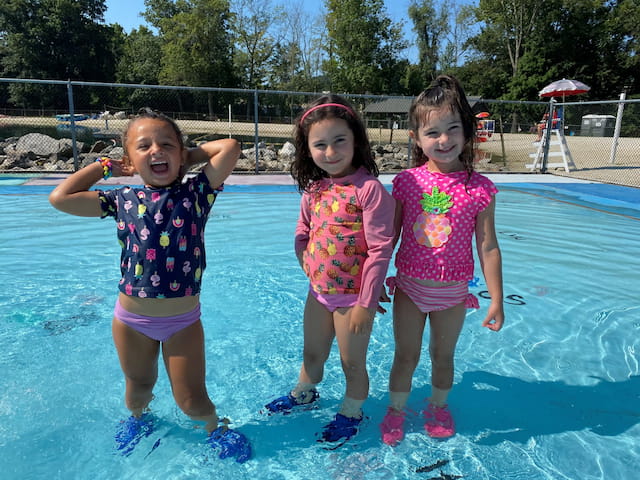 a group of girls in a pool