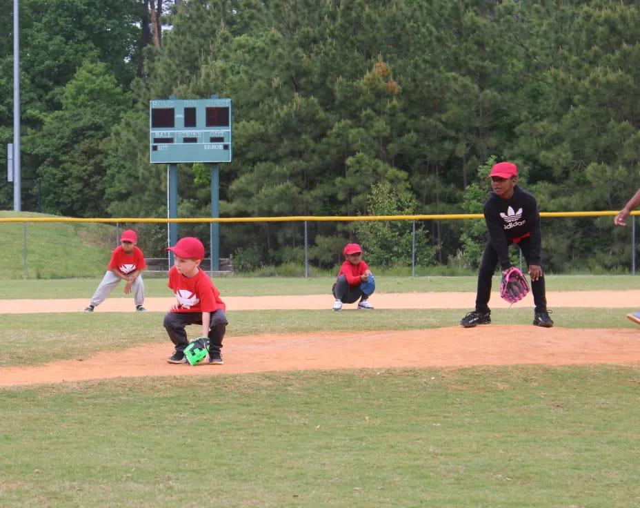 kids playing baseball on a field