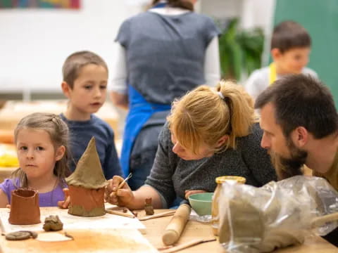 a group of children playing with clay