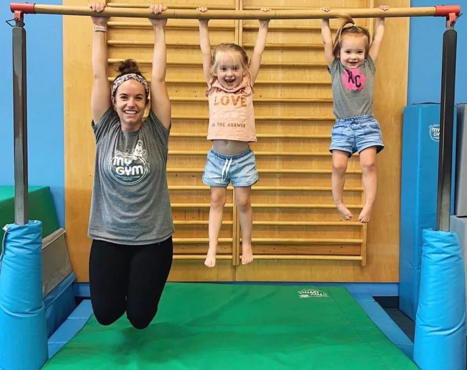 a person and a child on a playground slide