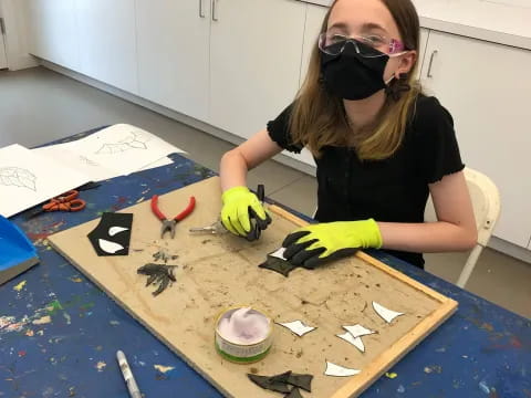 a person painting on a table