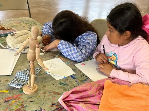 a couple of young girls painting