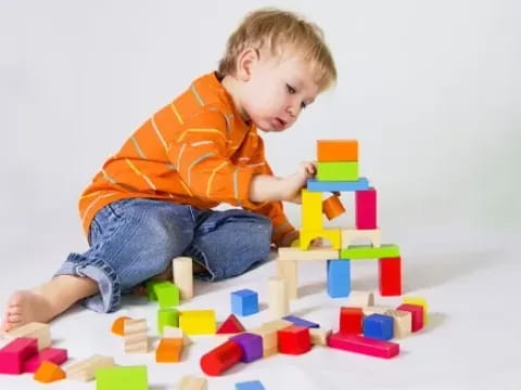 a baby playing with toys