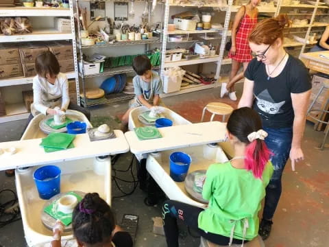 a group of people working in a workshop