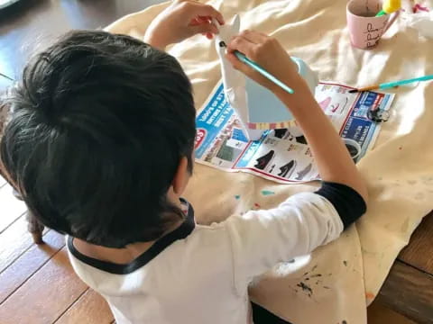 a young boy painting