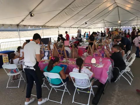 a group of people sitting at tables