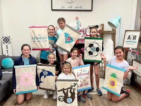 a group of children holding up signs