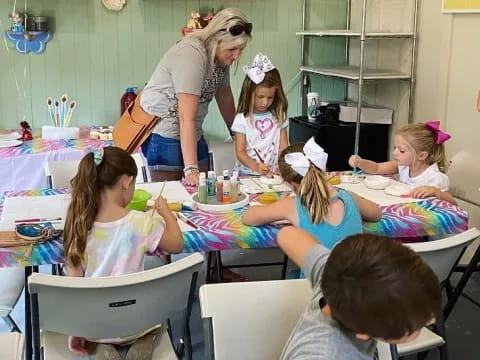a person teaching children in a classroom