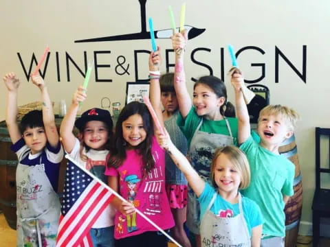 a group of children holding up a sign