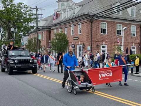 a person riding a tricycle with a sign on it