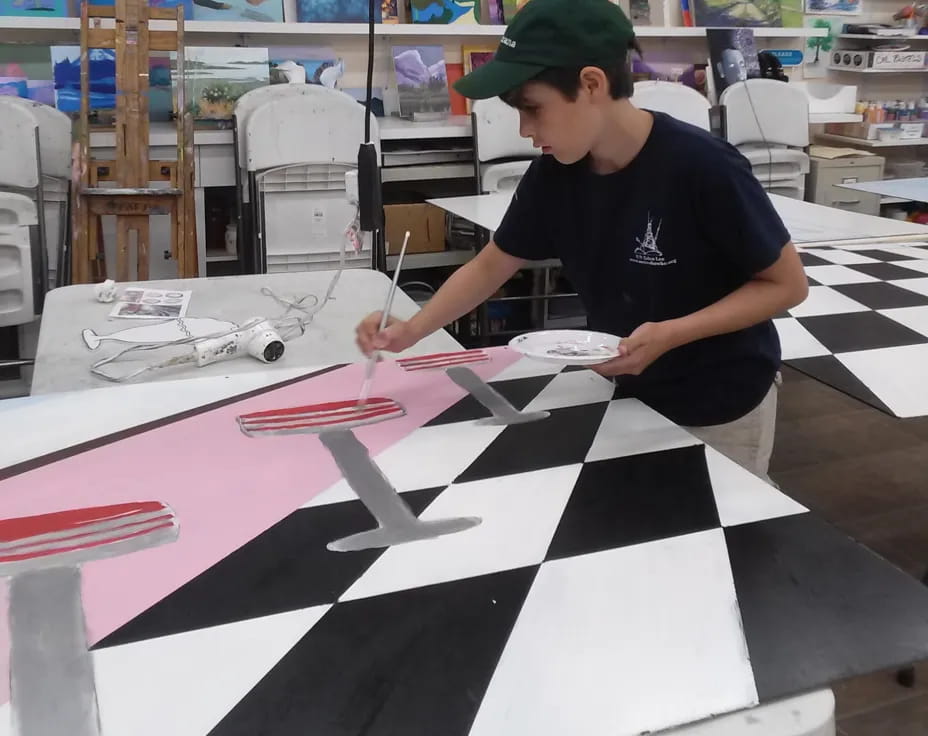 a person painting a table