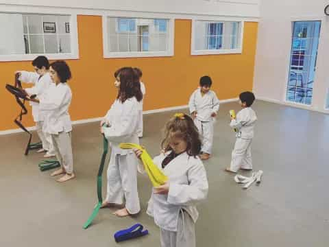 a group of people in white lab coats in a room