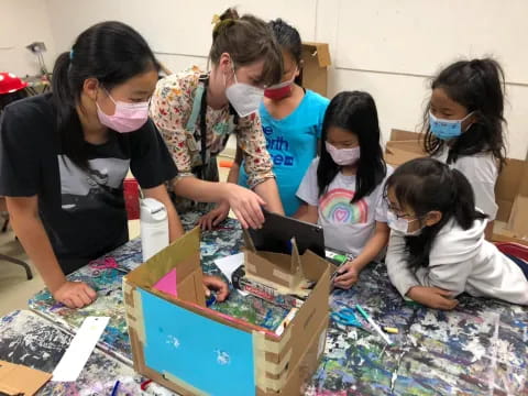 a group of girls wearing masks