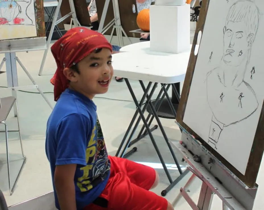 a boy sitting on a chair