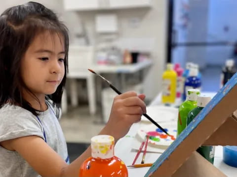 a young girl painting