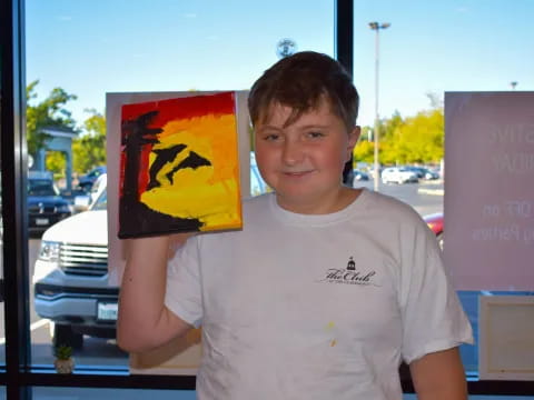 a boy holding a sign