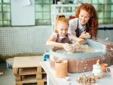 a person and a child making a cake