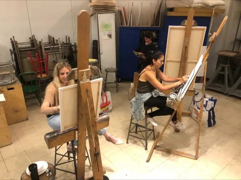 a group of people painting