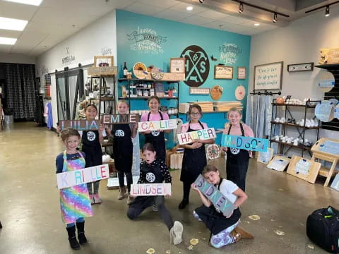 a group of children holding books