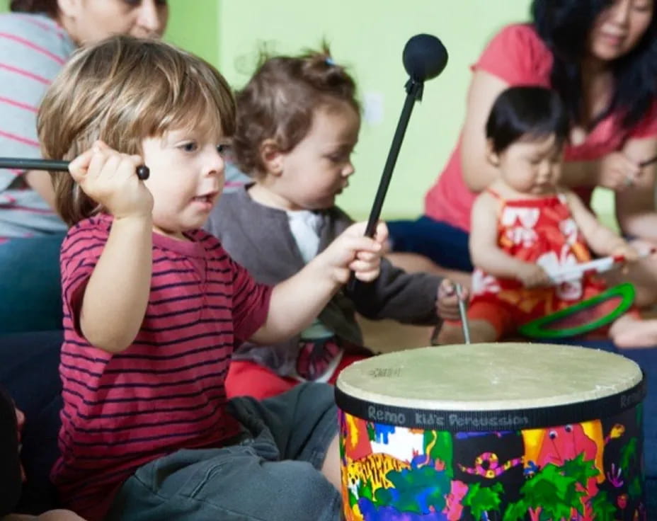 a group of kids playing drums