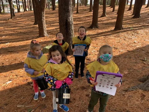 a group of children holding signs